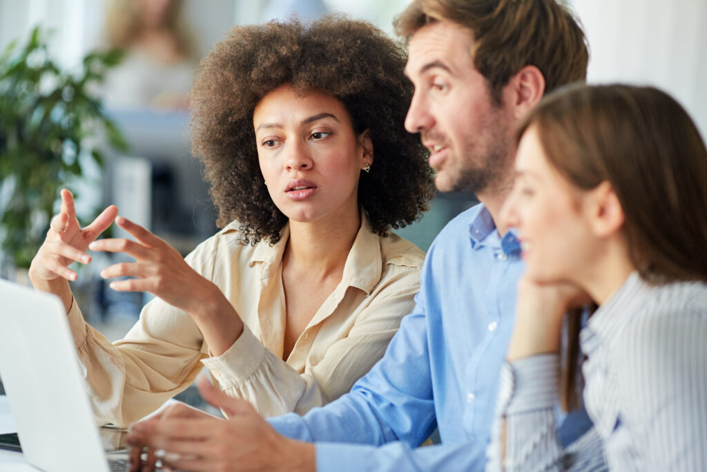 Startup concept - creative team talking in office