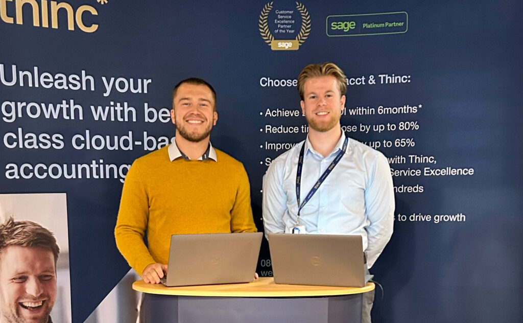 Thinc's consultants Ethan Jude and Joseph Ingle at the Thinc stand at an itSHOWCASE event.