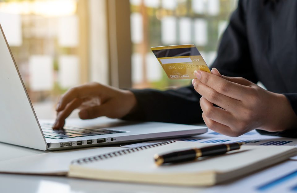 business hands holding credit card and using laptop computer for online shopping, Online payment and shopping