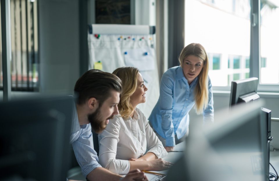 Team of colleagues working together in an office.